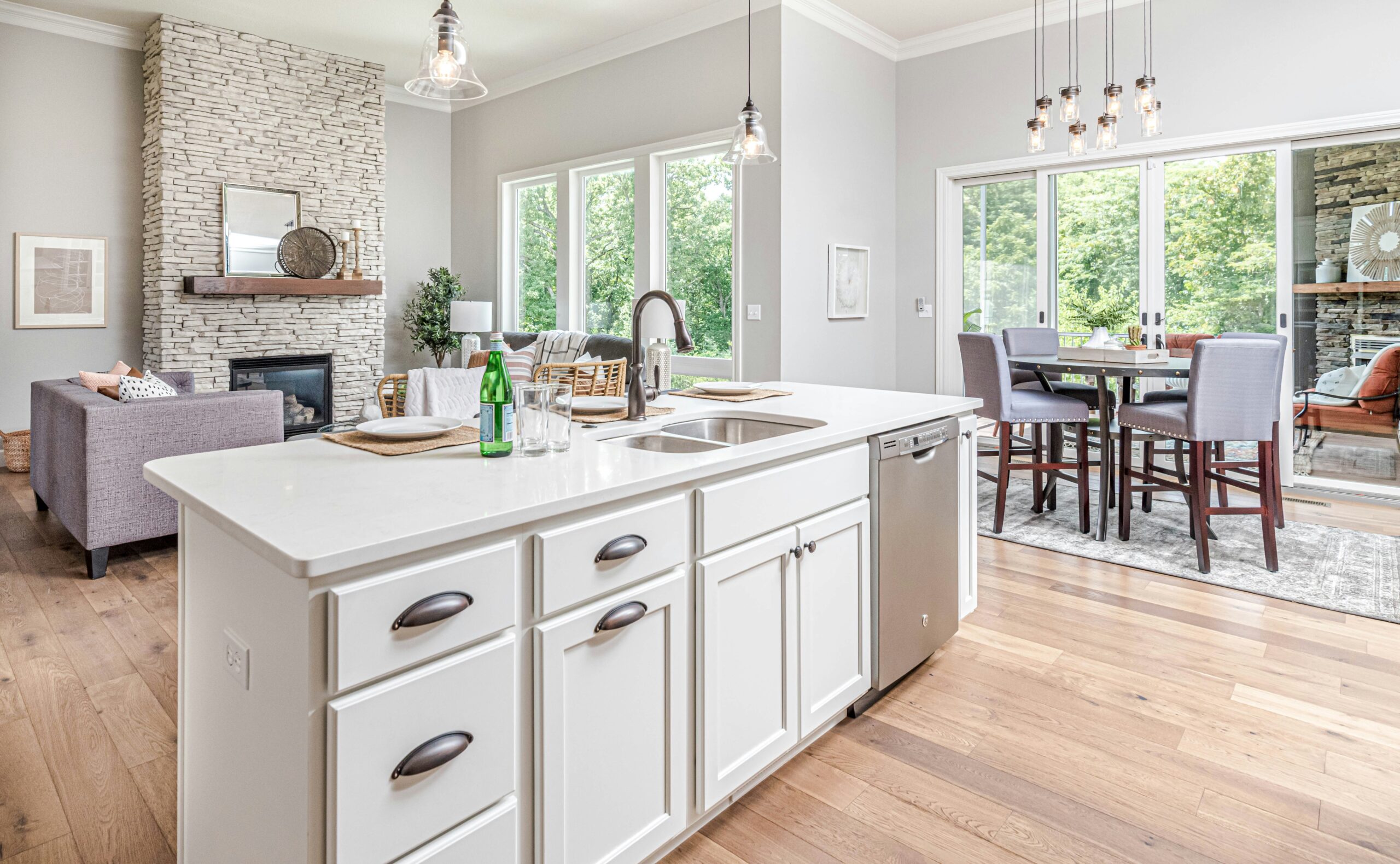 Clean Kitchen and dining room with white cabinets and counters